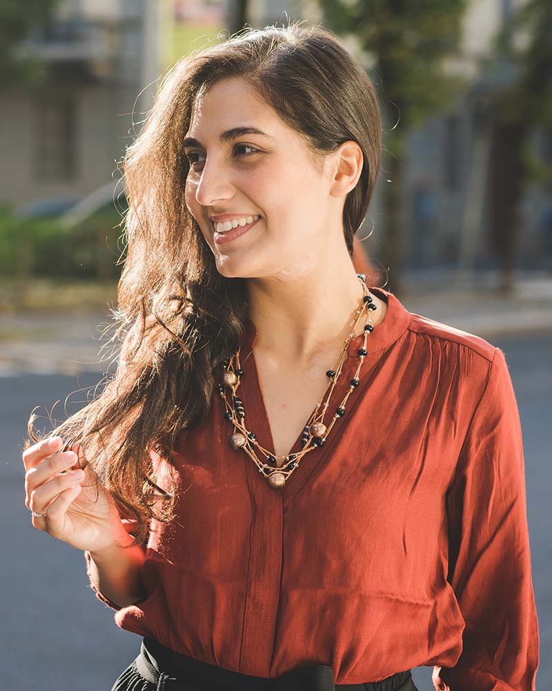 portrait-young-brunette-woman-outdoor-overlooking-VC59NUS.jpg